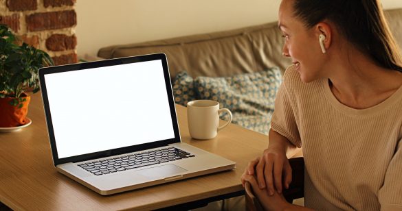 Woman watches the channel on a laptop